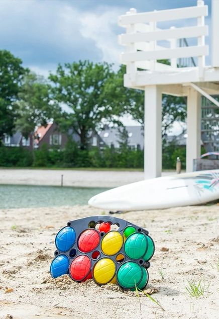 strand met surfbord | Bouman & Potter